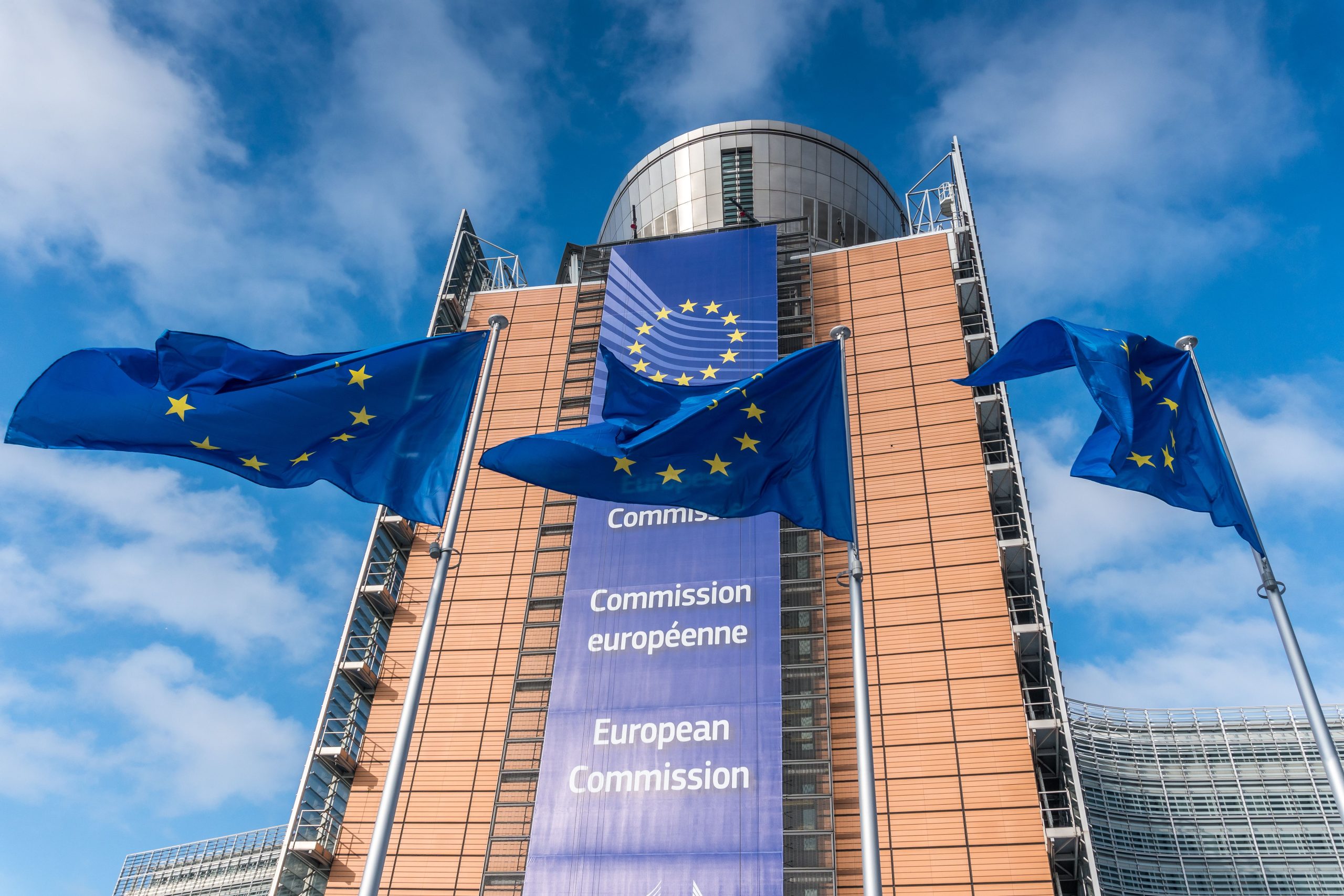 European Commission building and three EU flags (Santiago Urquijo / Getty Images)