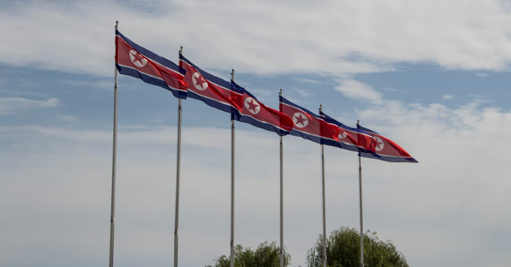 North Korean flags waving in the wind. 
