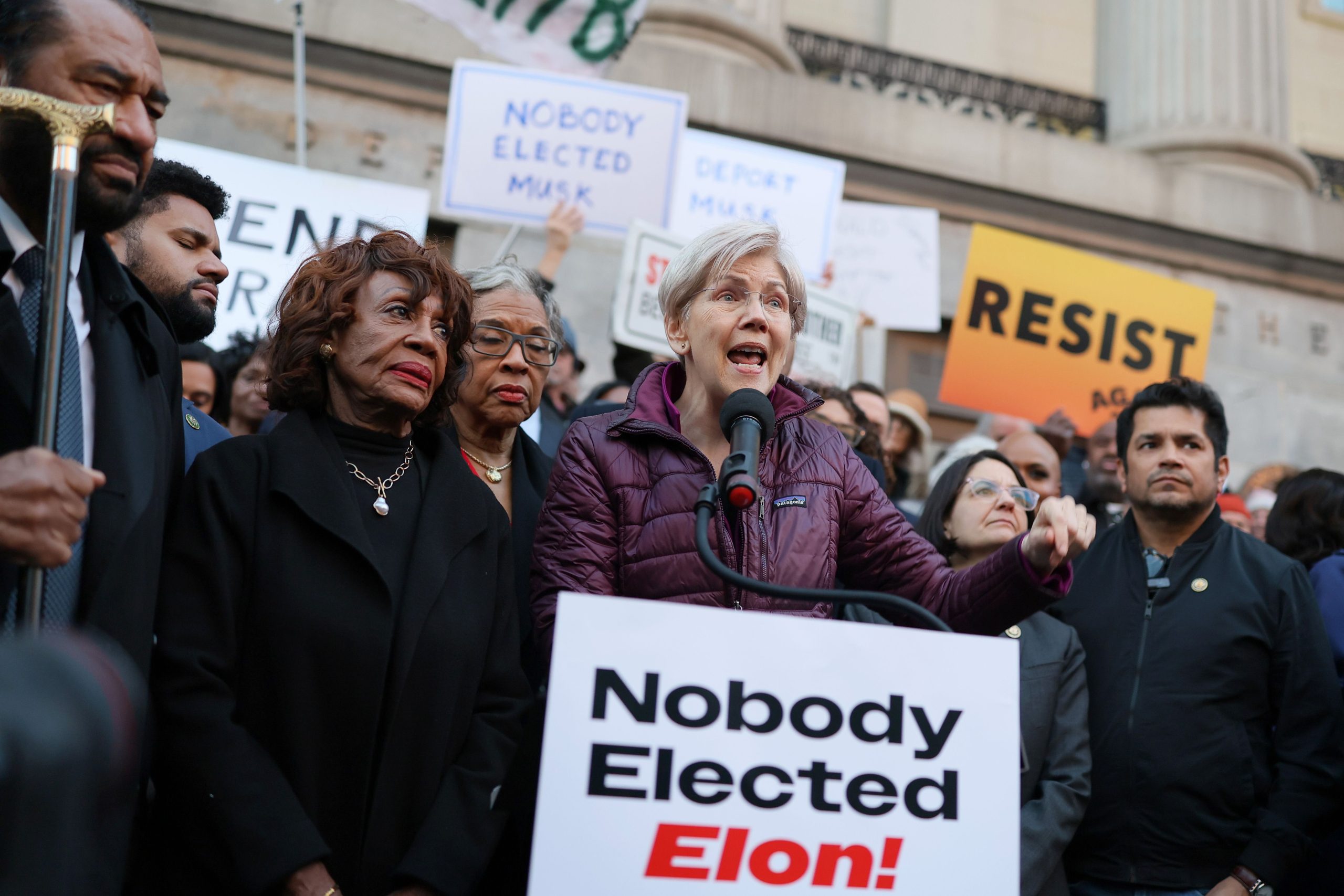 Representative Maxine Waters and Senator Elizabeth Warren protest