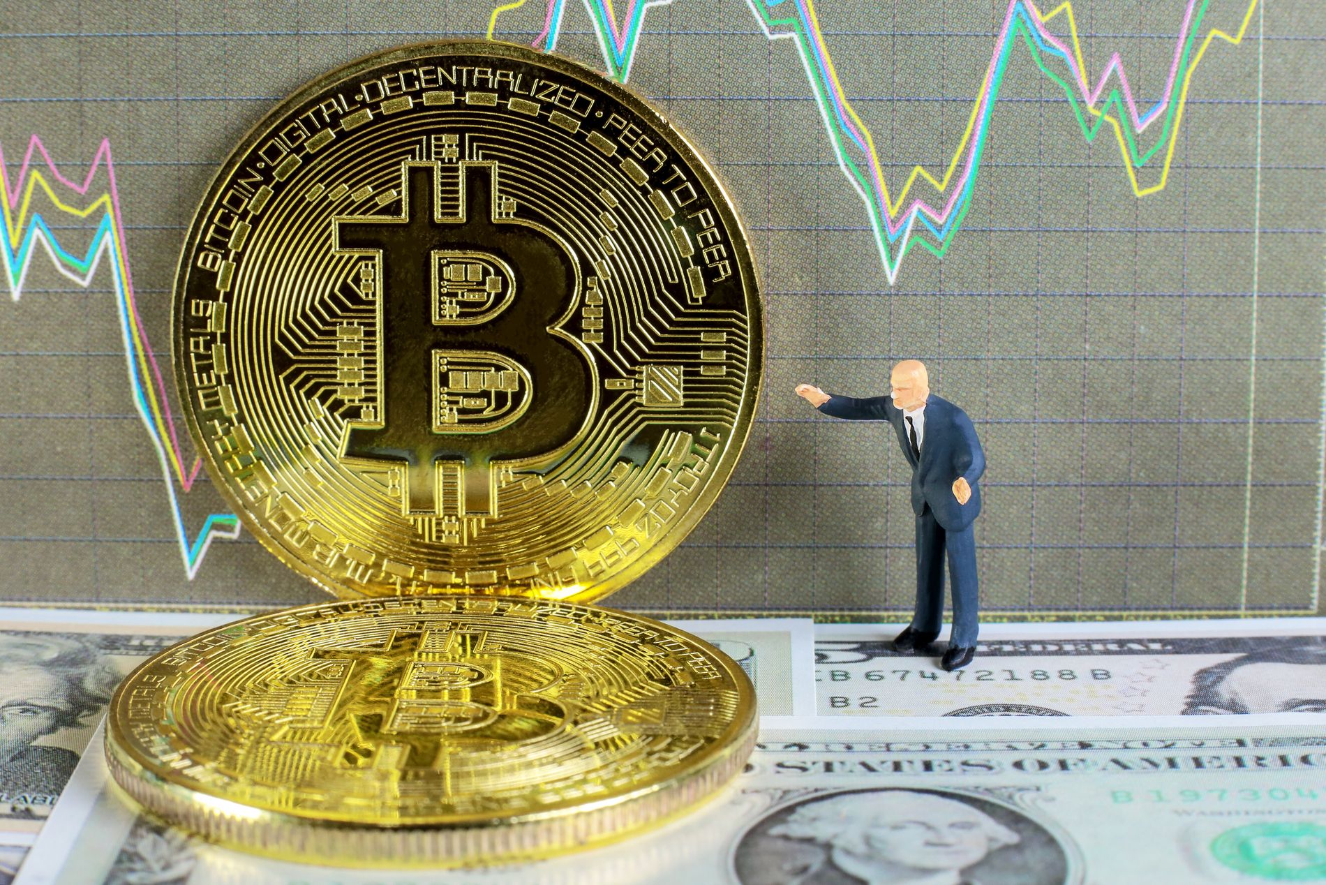 <em><a href="https://www.shutterstock.com/image-photo/businessman-taking-profit-bitcoin-trading-on-456071359">Business miniature image</a> via Shutterstock.</em>