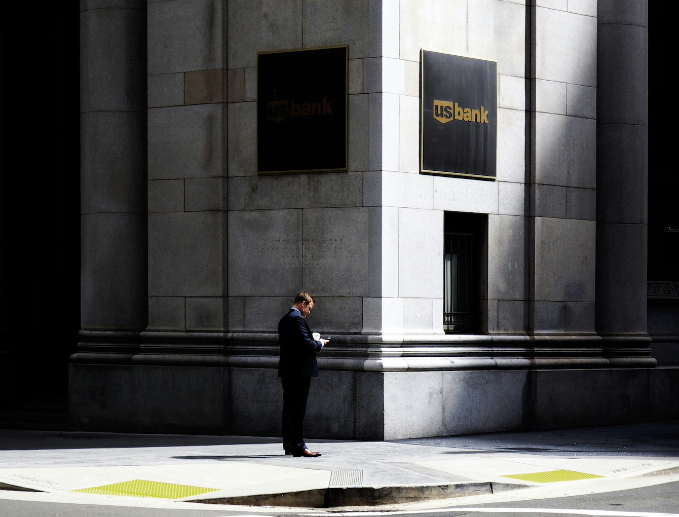 Man standing outside US bank