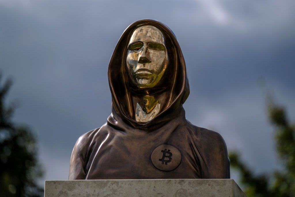 BUDAPEST, HUNGARY - SEPTEMBER 22: A statue of Satoshi Nakamoto, a presumed pseudonym used by the inventor of Bitcoin, is displayed in Graphisoft Park on September 22, 2021 in Budapest, Hungary. The statue's creators, Reka Gergely and Tamas Gilly, used anonymized facial features, as Nakamoto's true identify remains unconfirmed. (Photo by Janos Kummer/Getty Images)